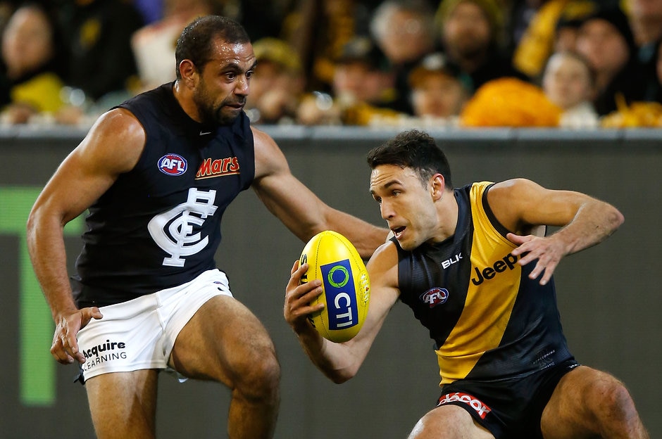 AFL 2015 Rd 15 - Richmond v Carlton MELBOURNE, AUSTRALIA - JULY 10: Shane Edwards of the Tigers and Chris Yarran of the Blues in action during the 2015 AFL round 15 match between the Richmond Tigers and the Carlton Blues at the Melbourne Cricket Ground, Melbourne, Australia on July 10, 2015. (Photo by Michael Willson/AFL Media)